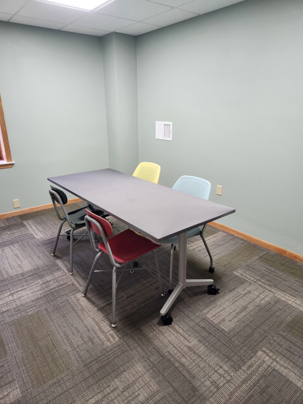 Meeting room showing table and 4 chairs