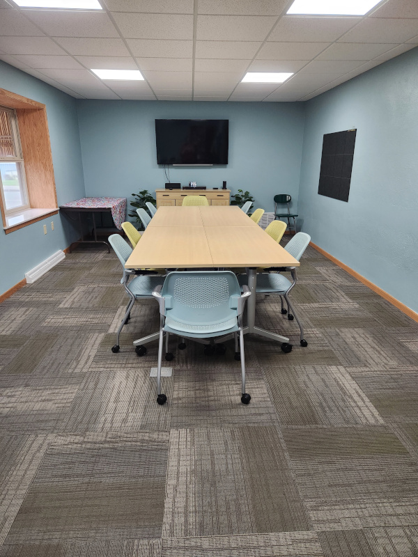 Program room showing table and 12 chairs